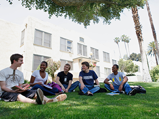 La Sierra University students sitting on the lawn