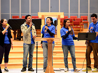Washington Adventist University students leading worship